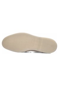 Schoenzool met gestructureerd oppervlak, licht beige kleur, uitgerust met een gevoerde zool en logo-afdruk nabij de hak. Glad en duurzaam materiaal.