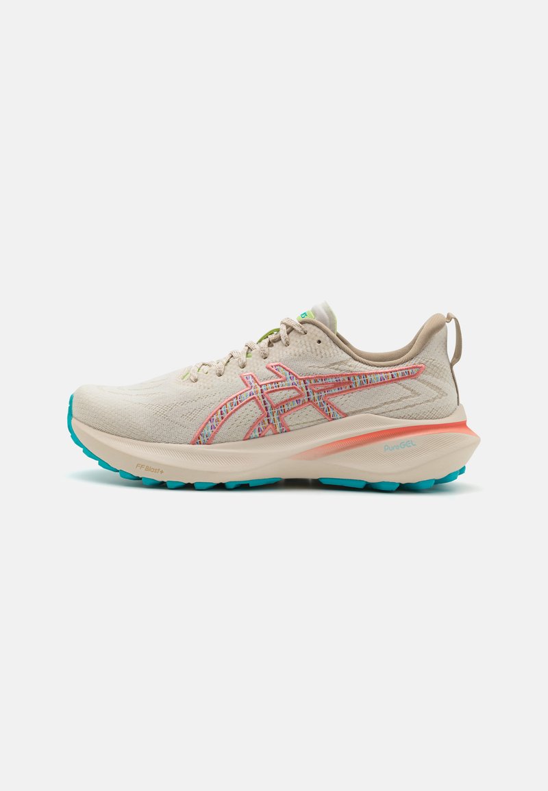 Light beige running shoe with pink and blue accents, mesh upper, textured finish, padded collar, and a cushioned sole.