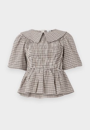 Peplum-bluse med en stor, spiss krage. Laget av et rutete stoff i beige og brune nyanser. Har smocket byste og korte ermer.