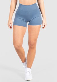Hoge taille, blauwe sportshorts gemaakt van rekbaar materiaal. Voorzien van platte naden en een gladde textuur, ontworpen voor comfort en flexibiliteit.
