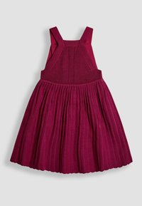 Ärmelloses strickrot Samtkleid mit breiten Trägern und plissiertem Rock für Kinder.
