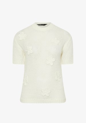 Valkoinen lyhythihainen neulepusero, jossa koholla olevat kukkakuvioinnit sekä resorinen pyöreä pääntie ja helma.