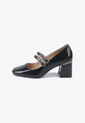 Black patent leather shoe with rounded toe, block heel, and dual straps adorned with decorative hardware. Smooth and glossy surface.