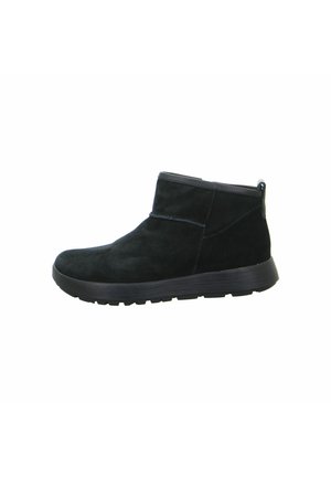 Schwarze Wildleder-Stiefeletten mit runder Zehenpartie, niedrigem Absatz und strukturierten Gummisohle. Besitzt ein einfaches Design und minimale Nähte.