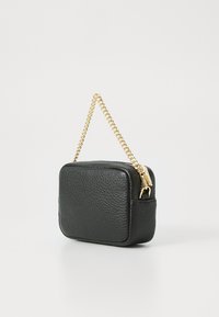 Black leather bag with a textured finish, rectangular shape, and a gold chain strap. Features a zip closure and rounded corners.