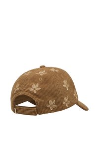 Bruine corduroy pet met een bloemendessin. Heeft een kromme rand en een verstelbare achterkant. De textuur is ribbelig en zacht.