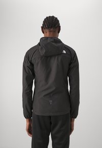 The North Face HIGHER RUN WIND JACKET - Veste de running - black