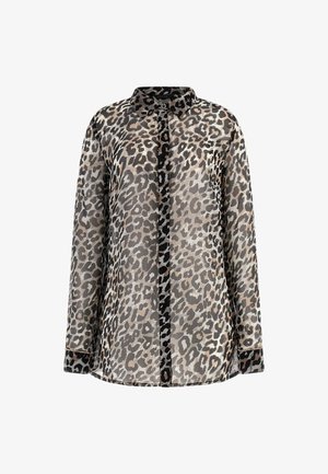 Blouse à manches longues à boutons avec imprimé léopard noir et beige, col classique et poignets bordés de noir.