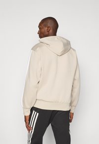 adidas Sportswear Bluză de molton cu fermoar - offwhite