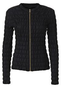 Giacca nera trapuntata con zip frontale, maniche lunghe, scollatura rotonda e superficie testurizzata. Presenta hardware della cerniera in tono oro.