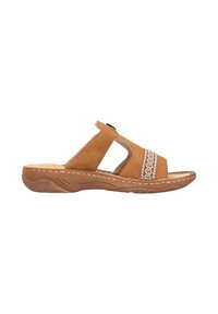 Tan leather sandal with cut-out design, woven detailing, and a cushioned sole. Features a low, textured outsole and decorative stitching.