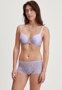 Light purple bra with lace trim and padded cups, paired with matching lace boyshorts featuring floral patterns and scalloped edges.