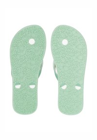 Gröna gummiflip-flop-sulor med blommönster och texturerat grepp. Har två cirkulära hål nära hälen. Slät, platt design.
