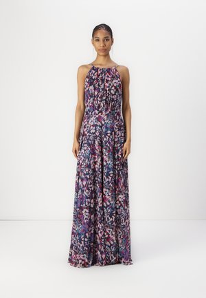 Long, flowy dress with a halter neck design. Fabric features a multicolored abstract pattern in shades of purple, pink, and white.
