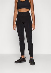 Champion SEAMLESS LEGGINGS SHOCK ABSORBER - Tamprės - black