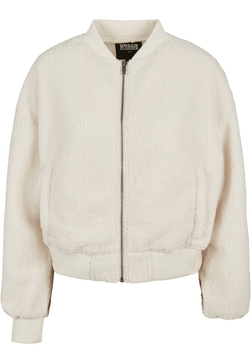 Cremefarget bomberjakke laget av teksturert fleece, med glidelås foran, ribbede mansjetter og kant. Myk, koselig og uformell design.