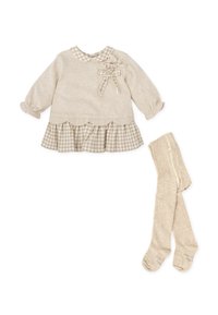 Haut beige à manches longues avec un ourlet festonné et un volan à carreaux, orné de nœuds ; associé à des collants beige assortis.