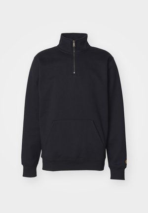 Black fleece quarter-zip sweatshirt with a high collar, ribbed cuffs, kangaroo pocket, and a small gold logo accent on the sleeve.