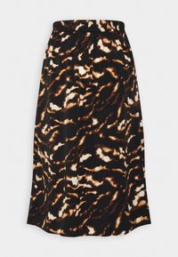 Jupe midi avec imprimé animalier abstrait en noir, brun et crème, et taille élastique.