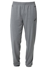 Šedé sportovní kalhoty s uvolněným střihem, elastickým pasem a bočními kapsami. Mají jemnou melírovanou texturu a černý logový akcent.