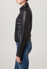 Black leather motorcycle jacket with a stand collar, zippered front, and side pockets; fitted design with smooth texture and minimal hardware.