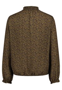 Blusa con stampa leopardata marrone, colletto alto arricciato, maniche lunghe e polsini elastici. Tessuto morbido, vestibilità ampia e dettaglio arricciato all'orlo.