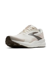 Zapatilla deportiva blanca con parte superior de malla, acentos beige y suela de goma marrón, que presenta cordones y un logotipo en el lateral.