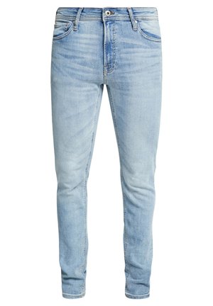 Ljusblå denimjeans med slim fit, fem fickor, dragkedja och kontrasterande sömmar. Slät yta med blekta områden.