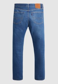 Blue denim jeans featuring a straight-leg design, two back pockets with curved seams, and a leather patch at the waistband.