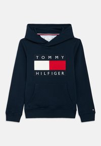 Dark navy hoodie with a front pocket, featuring a white, red, and blue logo on the chest. Made of soft cotton material.