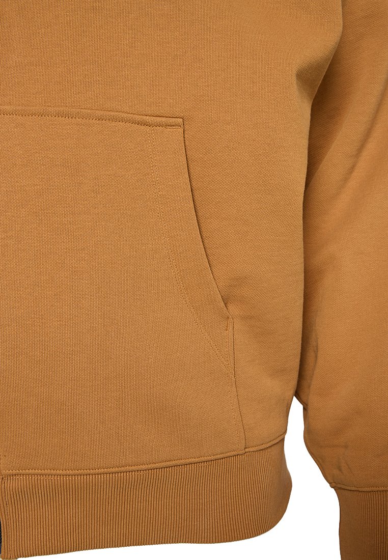 Felpa con cappuccio marrone caratterizzata da un tessuto testurizzato, polsini a coste e una tasca frontale a marsupio con dettagli di cucitura a contrasto.