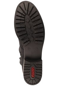 Black boot sole features a textured tread for traction, with a prominent red logo. Size indicator and design elements are present on the rubber.