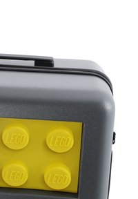 Gray hard case with a textured surface, featuring a bright yellow LEGO brick design and embossed "LEGO" text on four round studs.