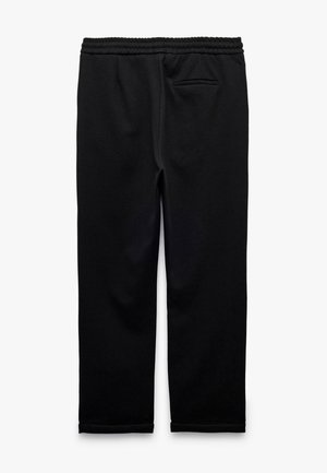 Sorte sweatpants lavet af blødt stof, med en elastisk talje, en baglomme og smalle ben med en afsluttet kant.