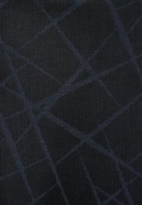 Textured fabric in black with a geometric pattern in dark blue. The design features intersecting lines creating a grid-like effect.