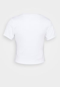White cropped t-shirt made of soft cotton. Features short sleeves and a round neckline. Smooth texture with no patterns or accents.