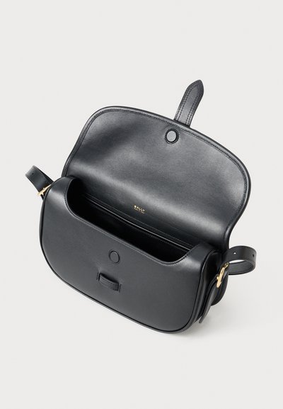 Black leather crossbody bag with a structured shape, featuring a single compartment, gold hardware, and a magnetic closure.