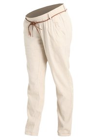 Světle béžové lněné kalhoty s elastickým pasem, zúženými nohavicemi a bočními kapsami. Měkká textura s jemnými švy.