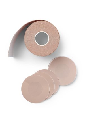 Rotolo di nastro adesivo nude con finitura texturizzata, accompagnato da diversi dischi adesivi rotondi e piatti dello stesso colore e simile texture.