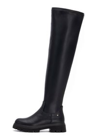 Botas negras por encima de la rodilla hechas de piel suave, con suela de goma gruesa y paneles laterales elásticos para un fácil ajuste.
