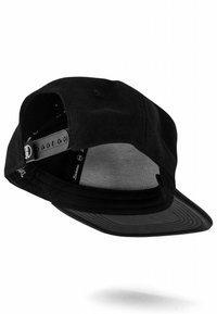 Black cap with a flat bill, wool exterior, and mesh interior lining. Features adjustable plastic strap and multiple ventilation holes.