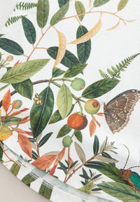 Floral print fabric featuring green leaves, orange and green fruits, a butterfly, and a beetle on a white background. Soft texture, round hem.