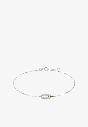 Bracelet en chaîne argentée mettant en valeur un maillon allongé rehaussé d'un accent en diamant et d'une petite touche d'or jaune, affichant un design et une texture modernes.