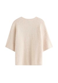 Kortærmet cremefarvet sweater lavet af blødt materiale; har en bred, afslappet pasform og ribbet halsudskæring; let tekstureret overflade.