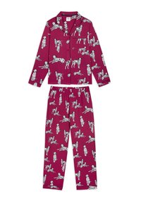 Lilla pyjamas sæt med et gentaget sort og hvidt dalmatiner print, bestående af en skjorte med knapper og bukser med elastisk talje.