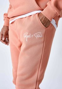 Project X Paris Pantalones deportivos - orange cuivre