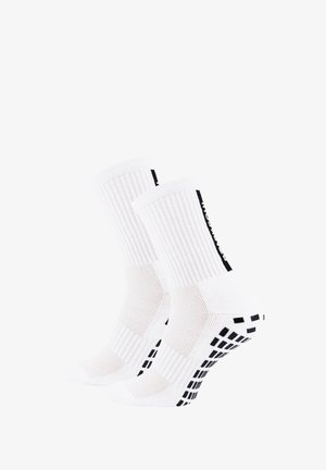 White socks with ribbed texture, mesh sections, and black grip accents on the soles. Features logo on the side for branding.