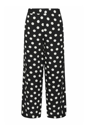 Pantalon noir à jambes larges avec de grands pois blancs, taille haute et coupe décontractée.