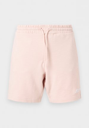 Světle růžové ležérní šortky s elastickým páskem a šňůrkou, s malým bílým vyšívaným logem na lemu levé nohy.