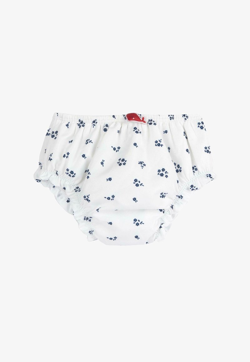 Bloomer bébé blanc avec motif floral bleu et taille élastique, comportant une petite décoration rouge en forme de baleine au centre devant.